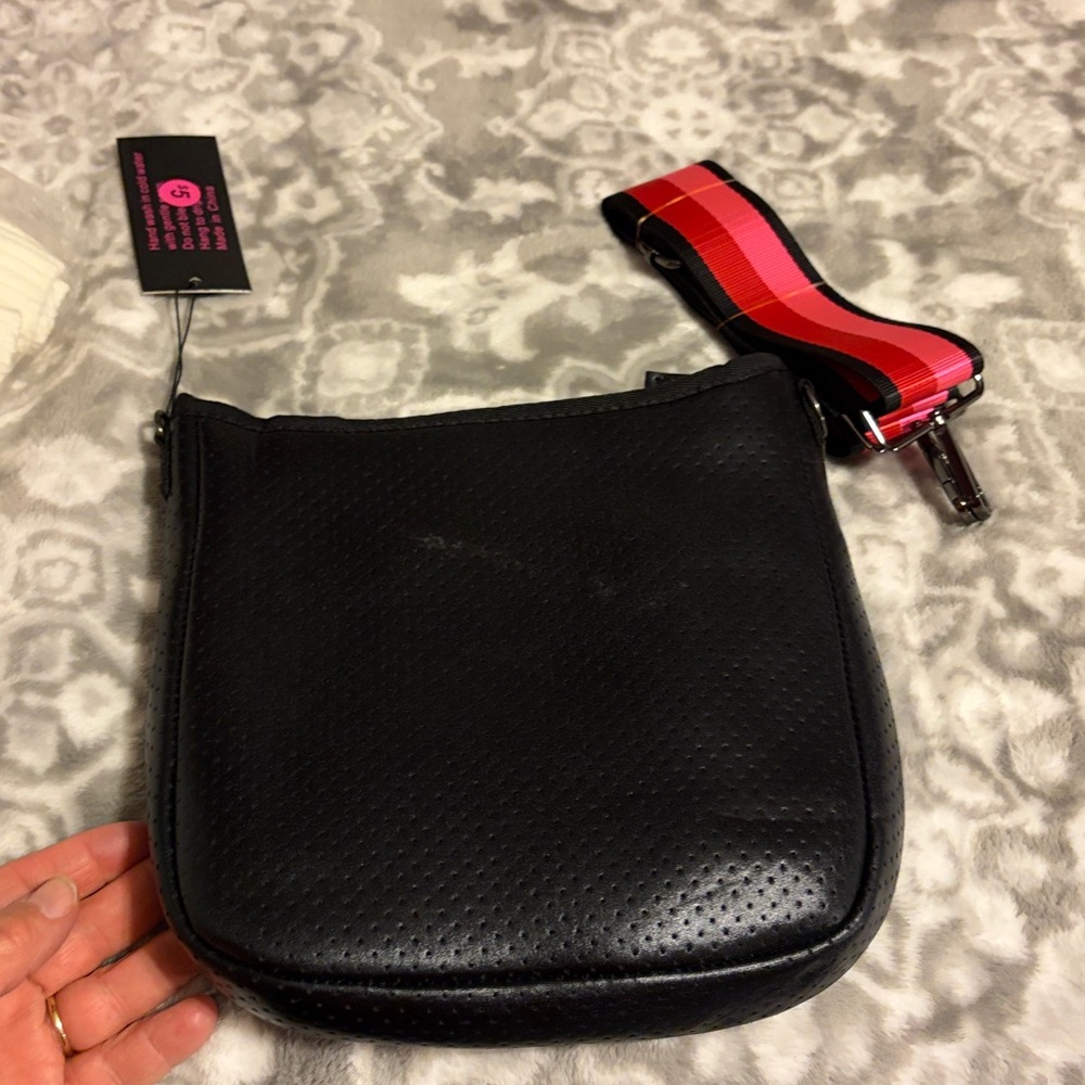 Haute shore brand.  Trendy Black and Gray Crossbody Bag with Pink Accents - Picture 2 of 8